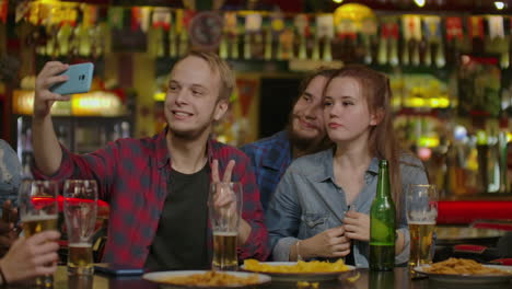 Friends-taking-selfie-at-bar-restaurant-drinking-cappuccino-and.-Irish-coffee---People-having-fun-together-at-fashion-cafeteria---Friendship-concept-with-happy