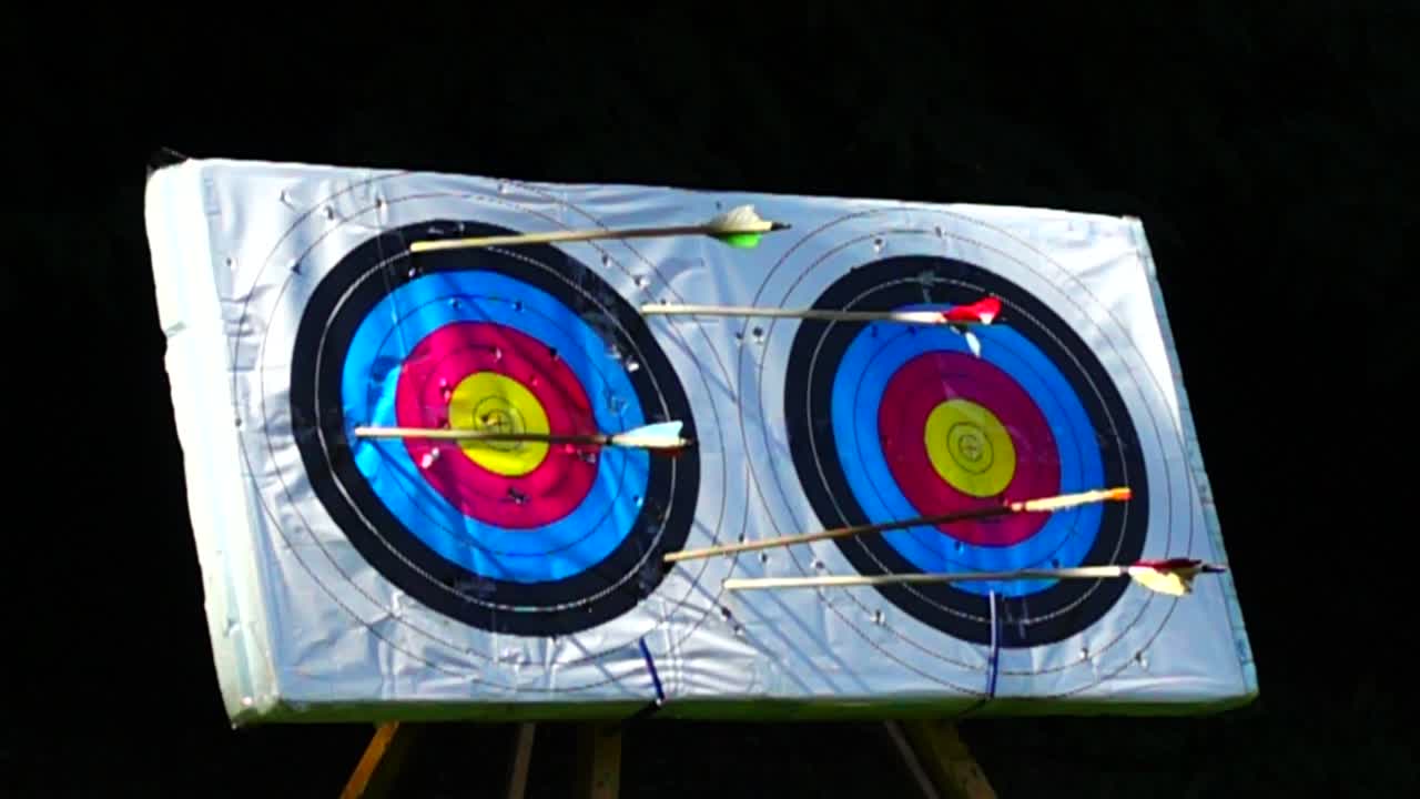 Archery. The arrow hit the target. Slow motion