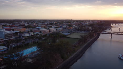 aerial view of town at sunset over river