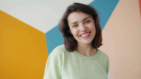 woman waving and smiling