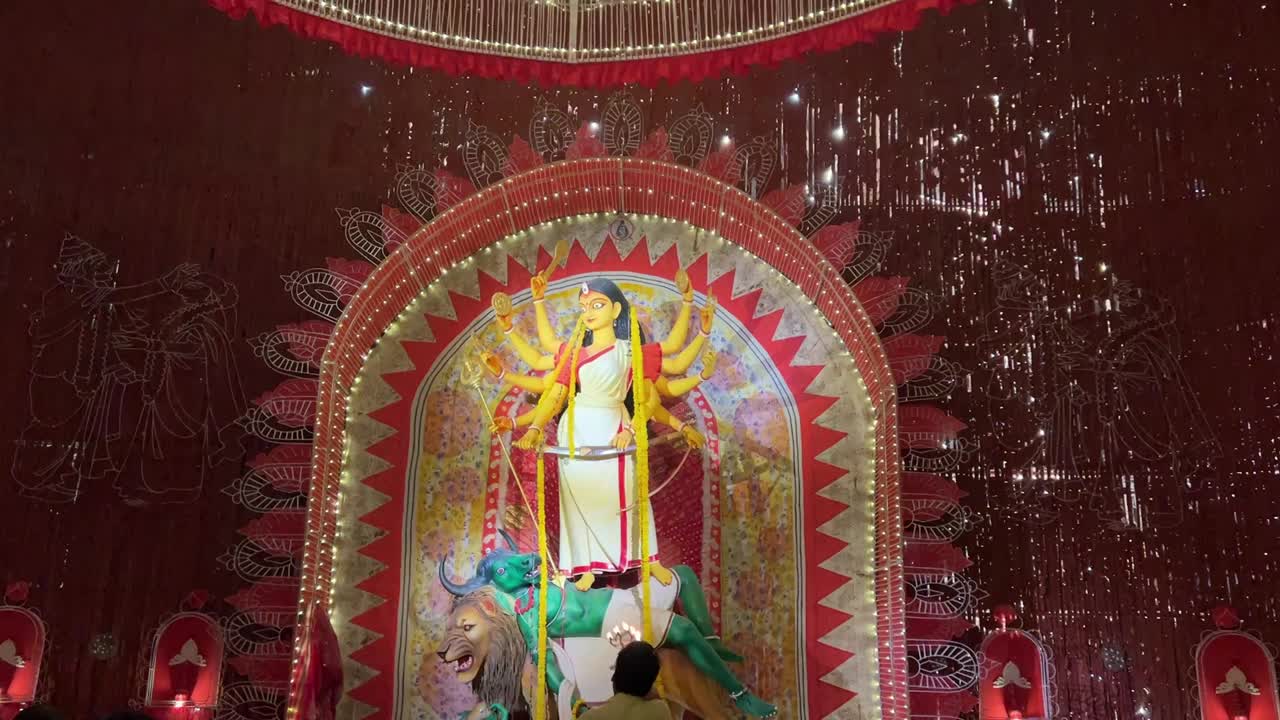 Priest offering prayer during Durga Puja festival in Kolkata, India