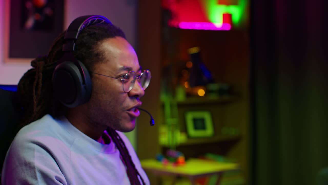 A Young Black Gamer Concentrates on His Game