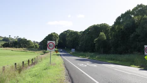 vehicles travel along a scenic countryside highway