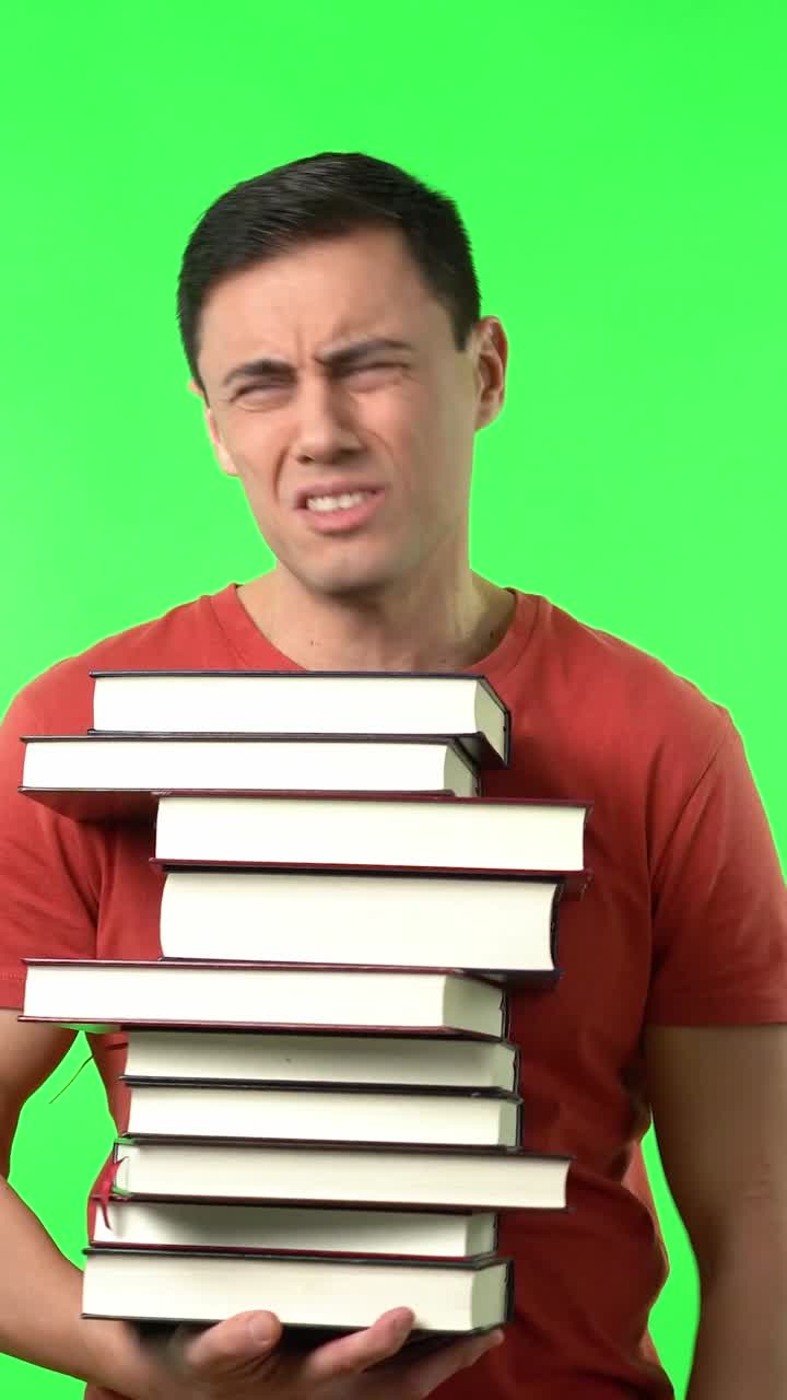 Man holding a stack of books