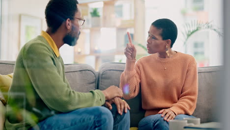 Fight,-stress-and-couple-on-sofa-with-problem