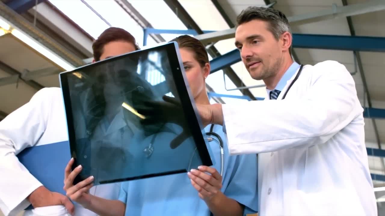 Doctors examining Xray scan