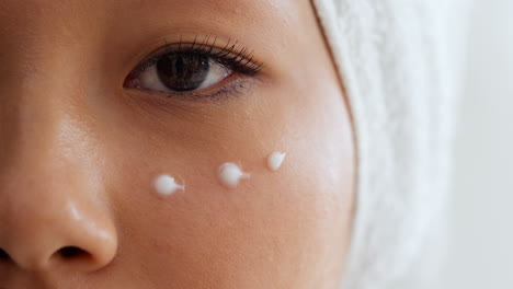woman applying face cream