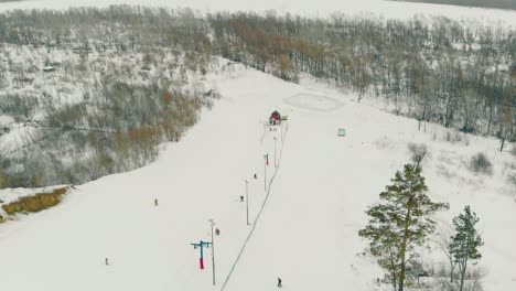 modern ski trail and surface lift at winter wood upper view