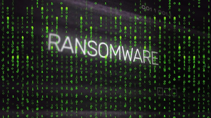 Animation of ransomware text with circuit board pattern over binary codes against black background