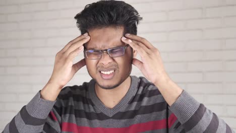 young man experiencing headache