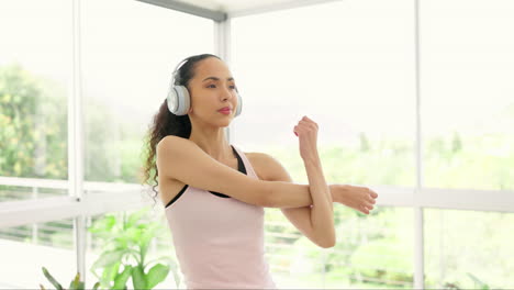 music headphones, stretching arm