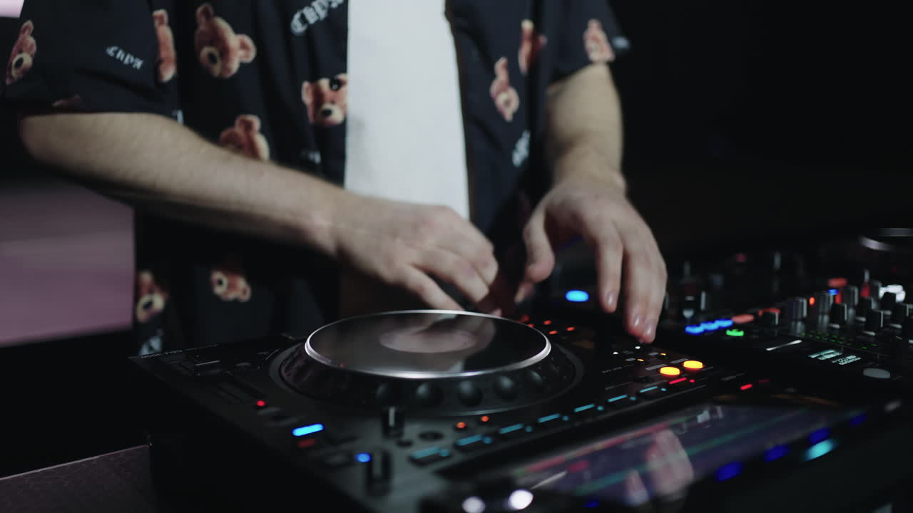 DJ Mixing Music on Turntables
