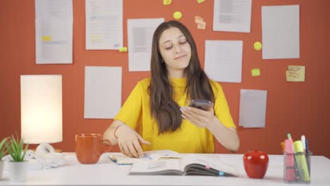 Phone-addicted-girl-child-plays-games-on-the-phone-at-home