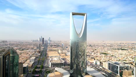 wide angle establishing drone shot kingdom centre skyscraper in riyadh