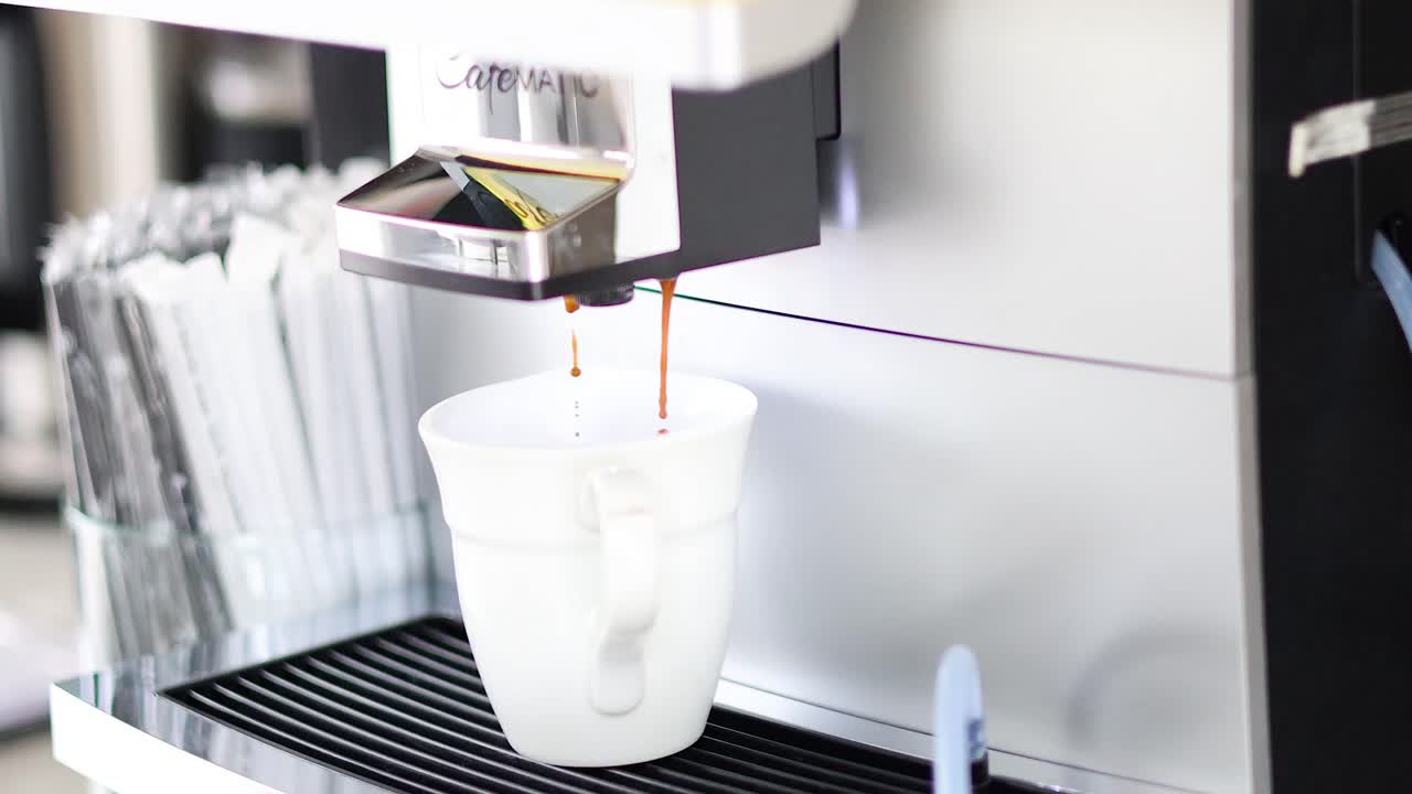 Sequence of coffee being dispensed into a cup
