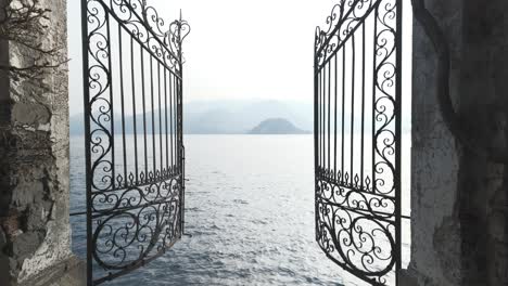 gate to lake como, also known as heaven's gate in the gardens of villa cipressi, varenna, italy