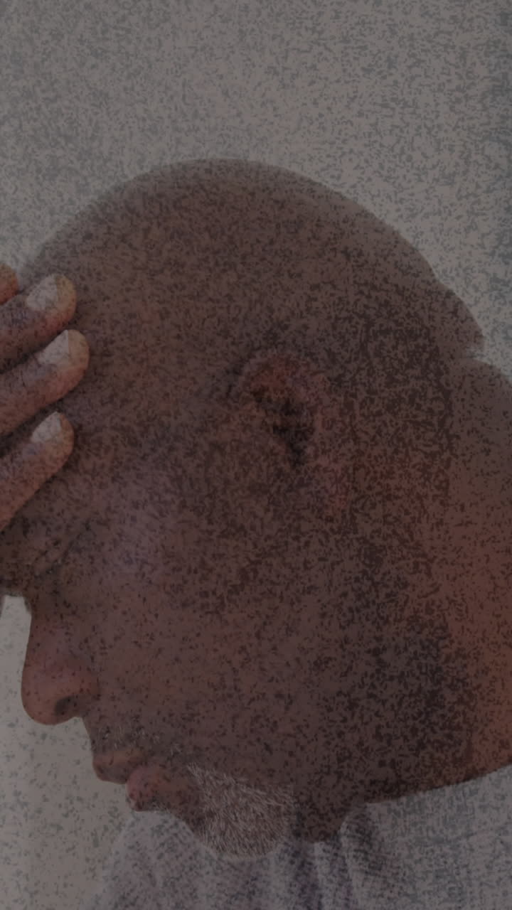 Animation of moving background over african american man touching forehead