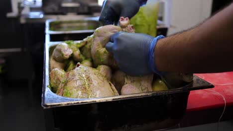 cook preparing roasted chicken in kitchen 60fps