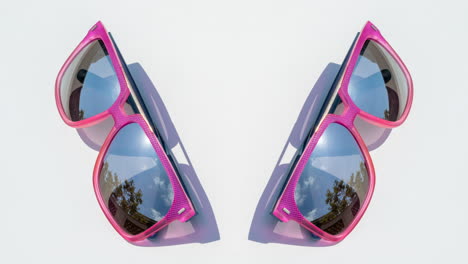 mirrored sunglasses reflecting clouds