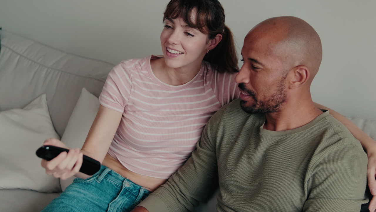 Happy Couple Watching TV Together