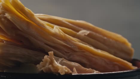 fermented soy food fuzhou, tofu skin yuba sticks or fuzhu on plate. healthy asian soy food, korean and chinese cuisine.