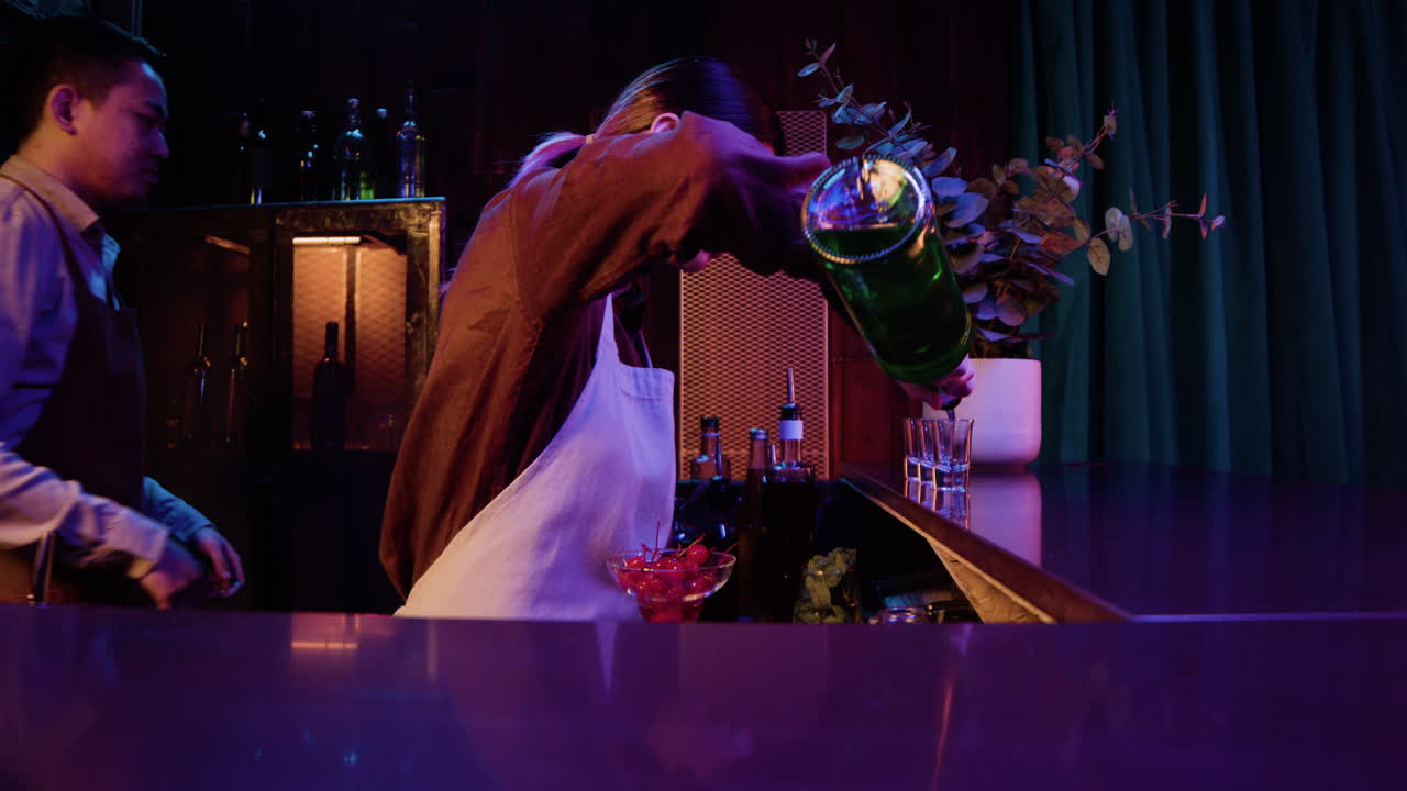 Bartenders working in bar