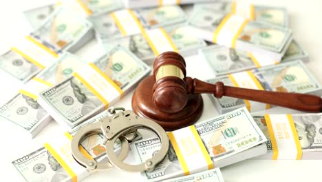 justice, law, and financial crime: gavel, handcuffs, and money