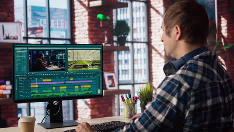 man using mouse to edit movie project footage in apartment home office