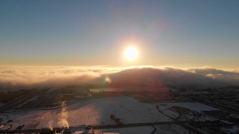 Aerial-view-of-fog-over-city-moving-from-left-to-right