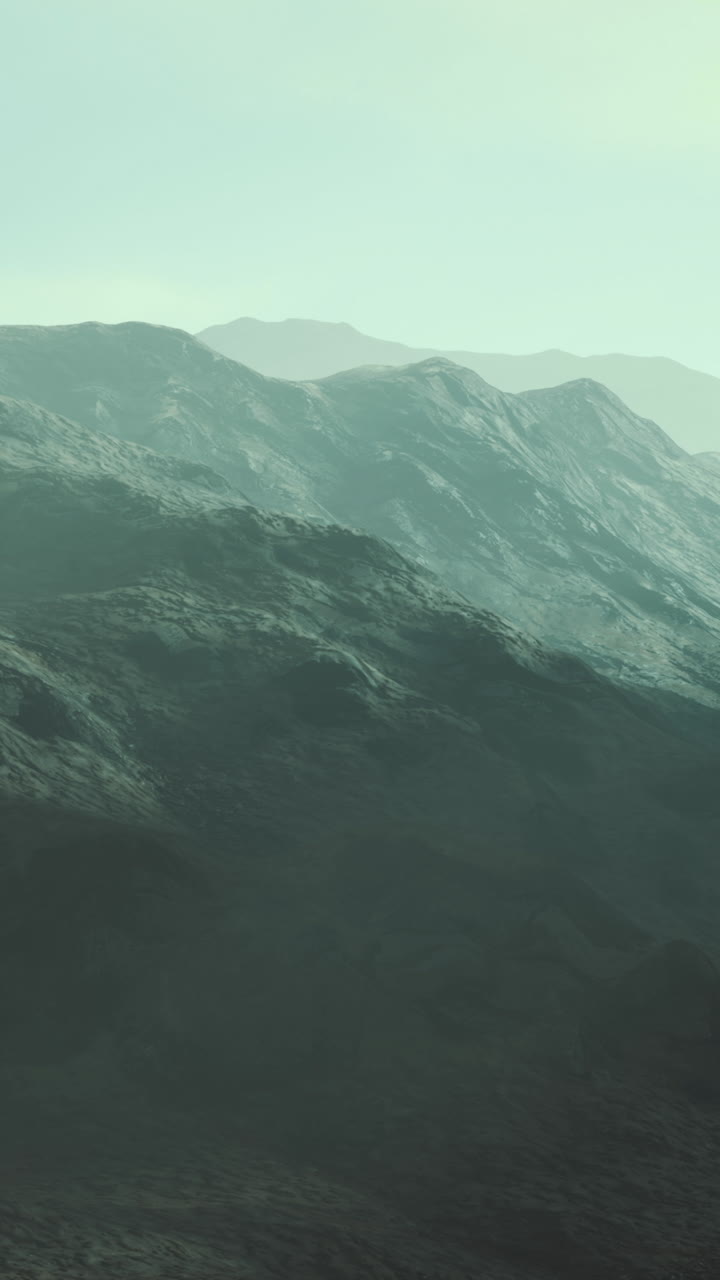 Majestic mountain landscape bathed in soft ethereal light at dawn