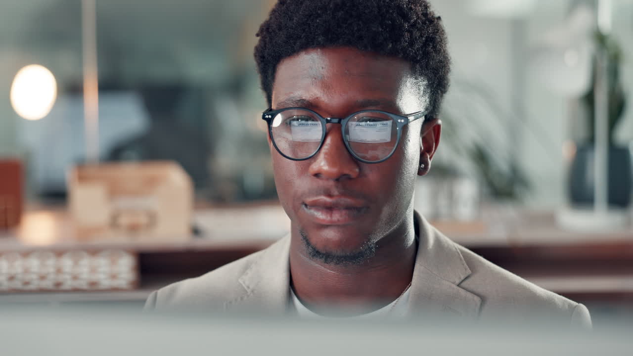 African American businessman working on computer in office