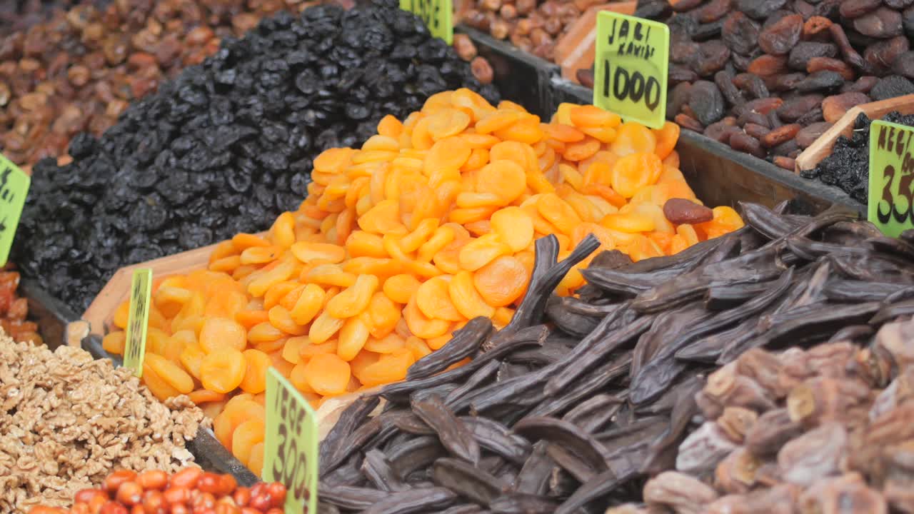 Assortment of dried fruits and nuts at a market stall