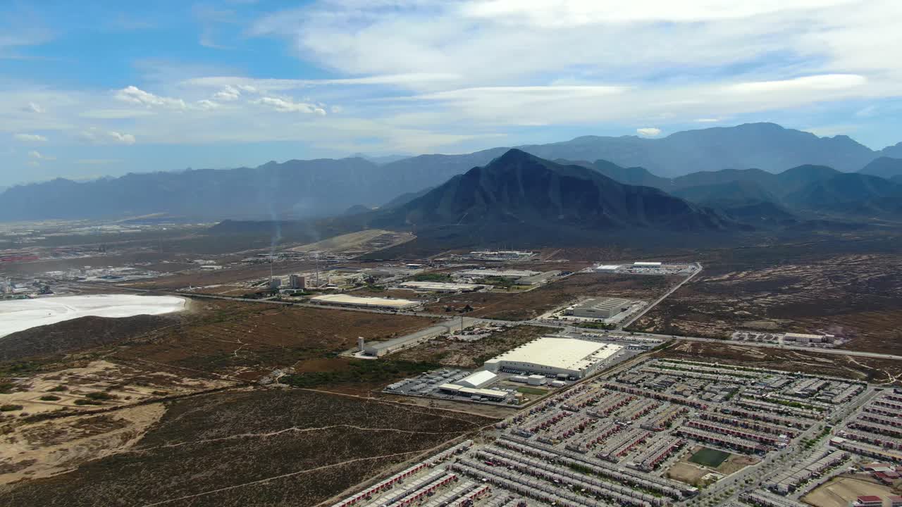 Panoramic view of Monterrey in Mexico with thousands of low houses and mountains background