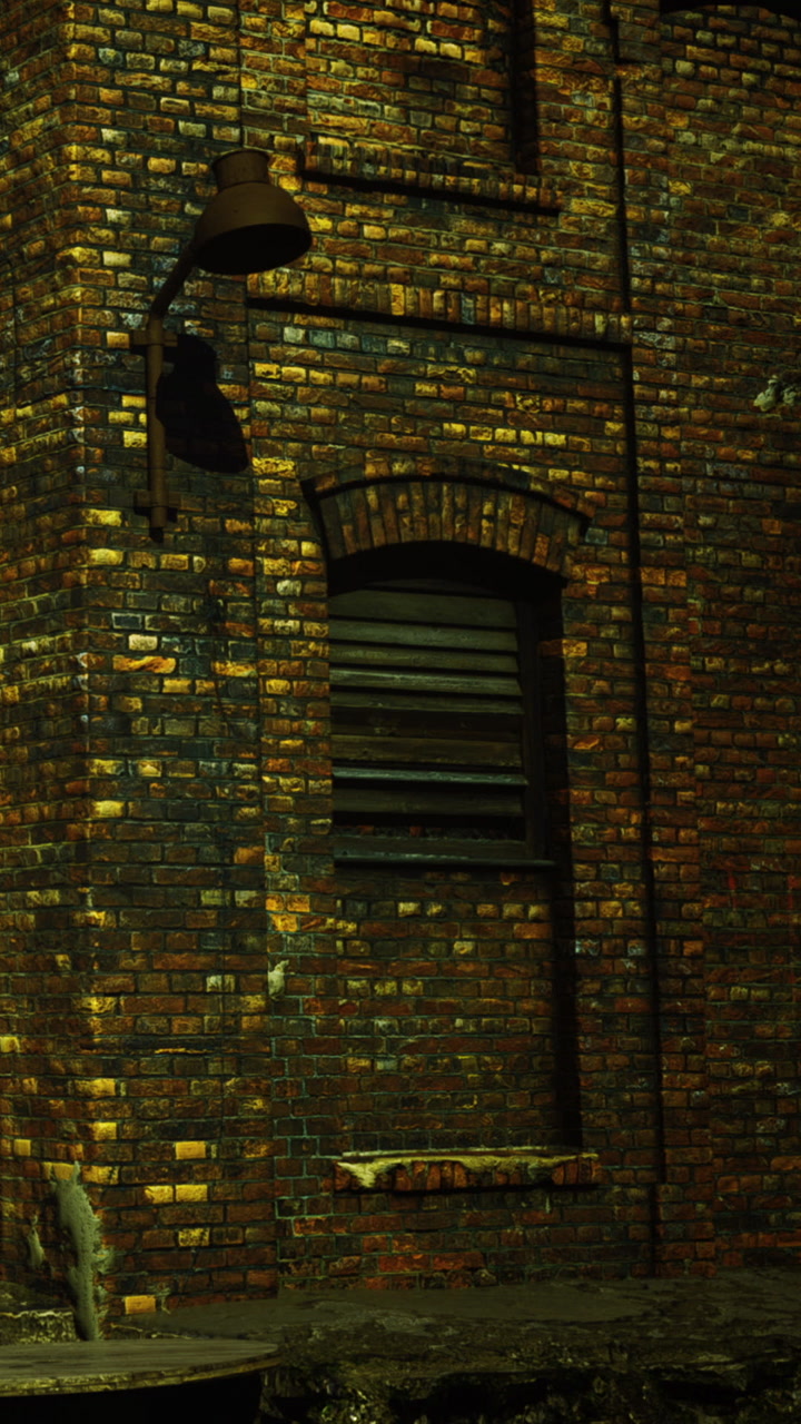 Old brick wall with window and bell in a dimly lit urban setting