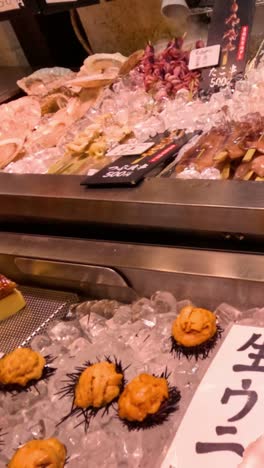 variety of seafood displayed at a busy market