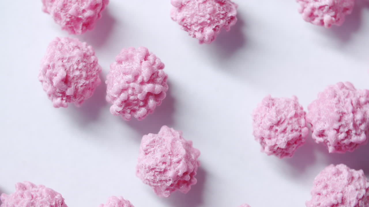 Macro close up shot of spinning particles looking like a virus through a microscope