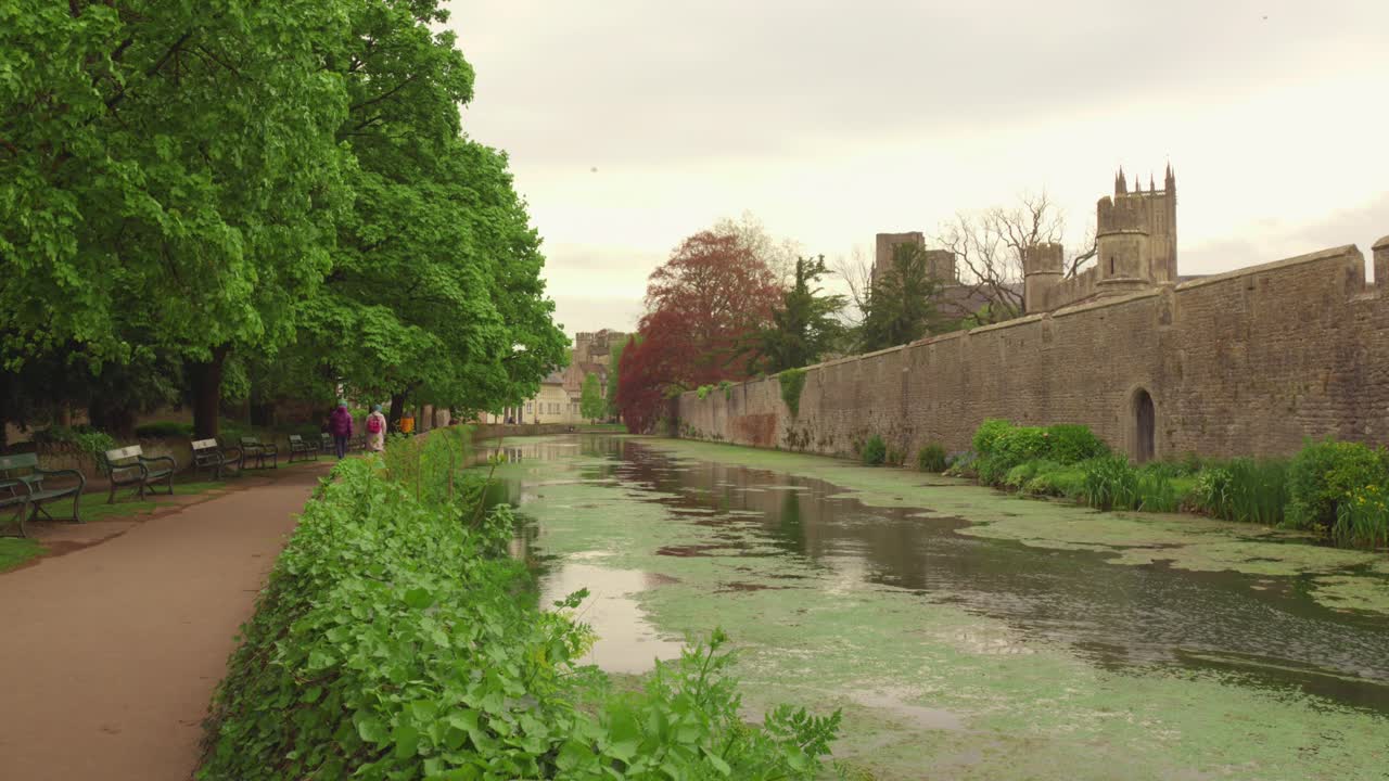 Walking along the City Wall and Canal in a Historic City
