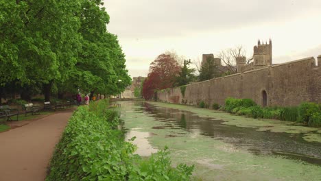 walking along the city wall and canal in a historic city