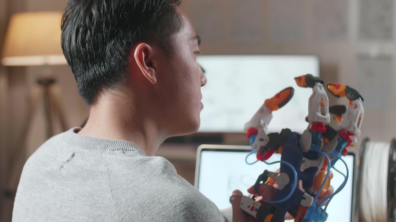 Man working on a robotic hand project