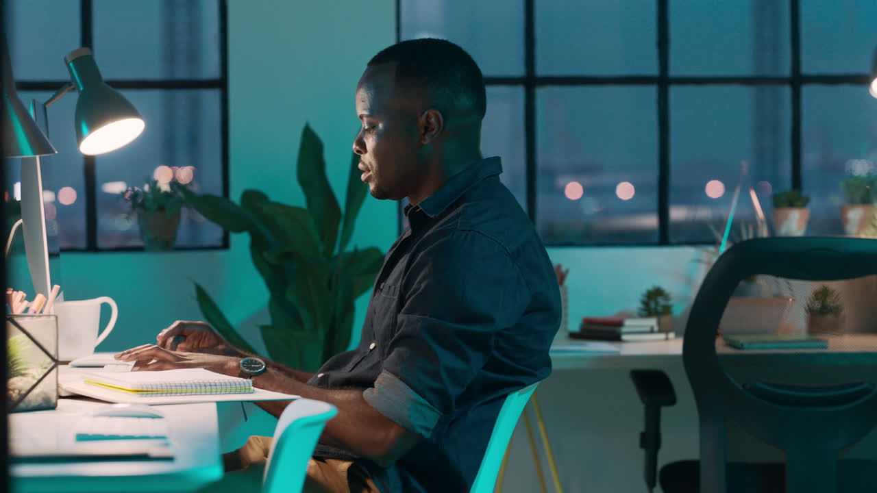 Black man, computer and work in night at startup