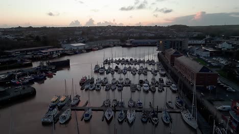 quiet marina at sunset with boats docked in milford waterfront, pembrokeshire