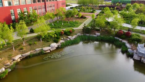 cinematic aerial view of an artificial lake in beijing jiaotong university, weihai campus, china