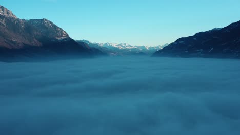 Excellent-Aerial-View-Of-A-Cloud-Blanket-Stretching-From-Martigny-To-Chamonix,-Switzerland