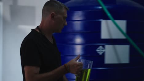 worker inspecting chemical containers