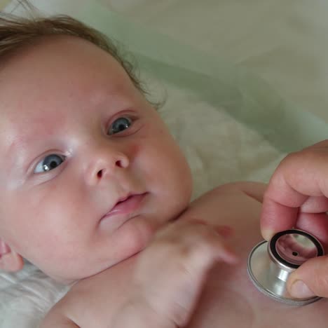 sweet baby examined with stethoscope