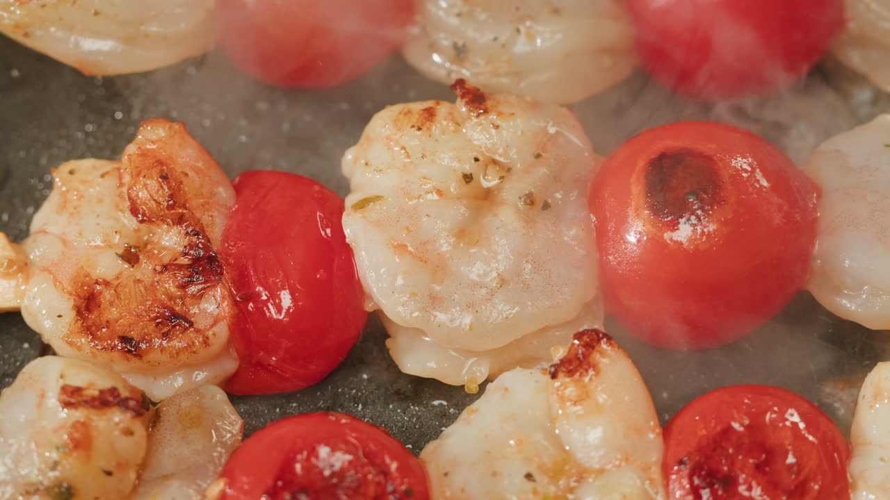 Shrimp and Tomato Skewers Cooking in a Pan