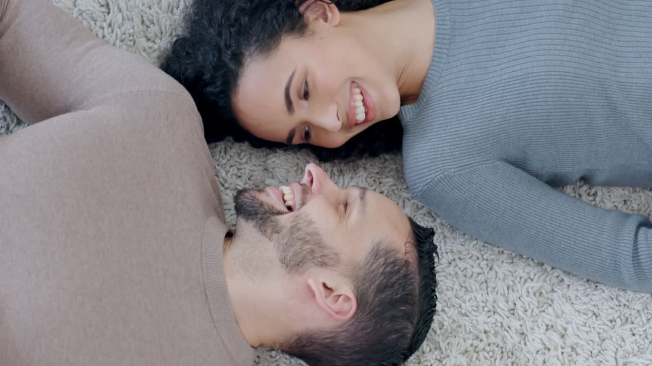 Top view, love or happy couple on the floor