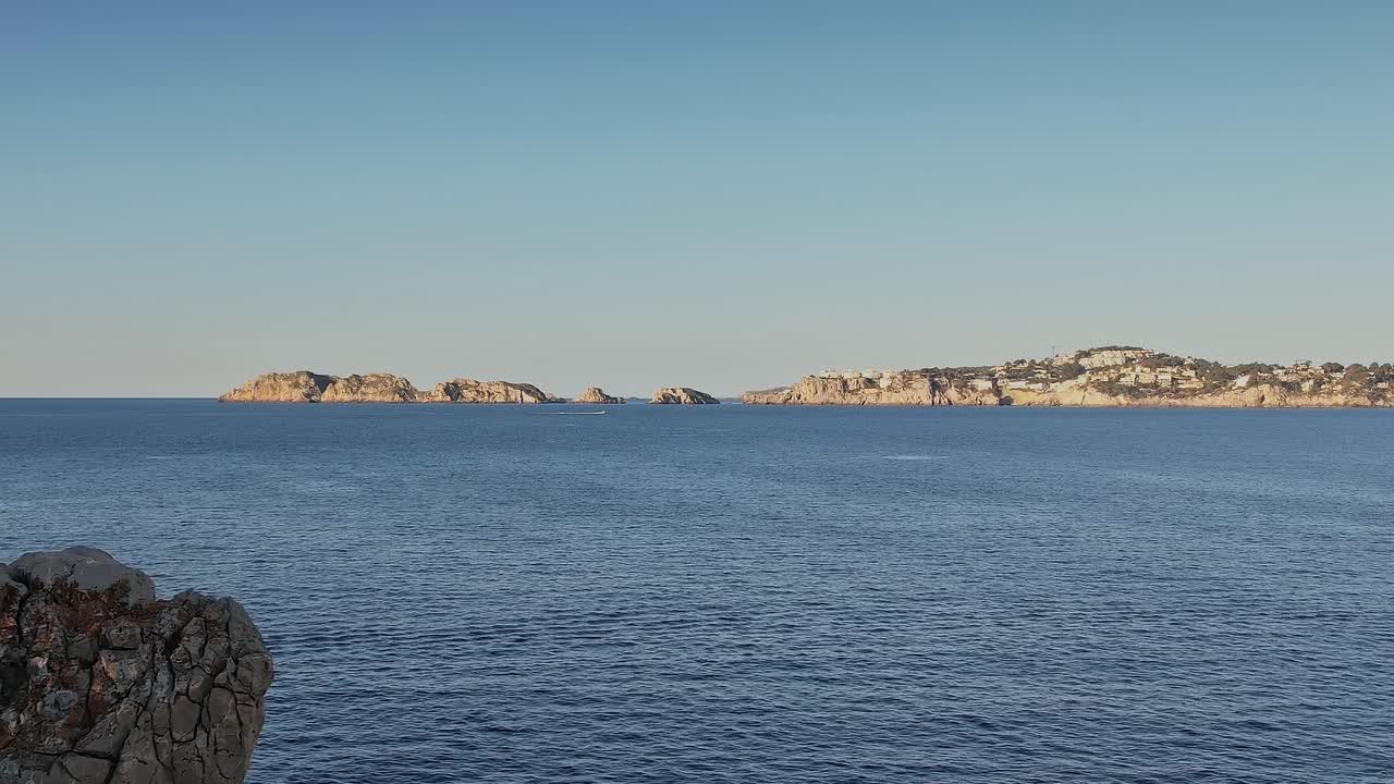 Views of the rocky coast and distant hills in Mallorca, Spain