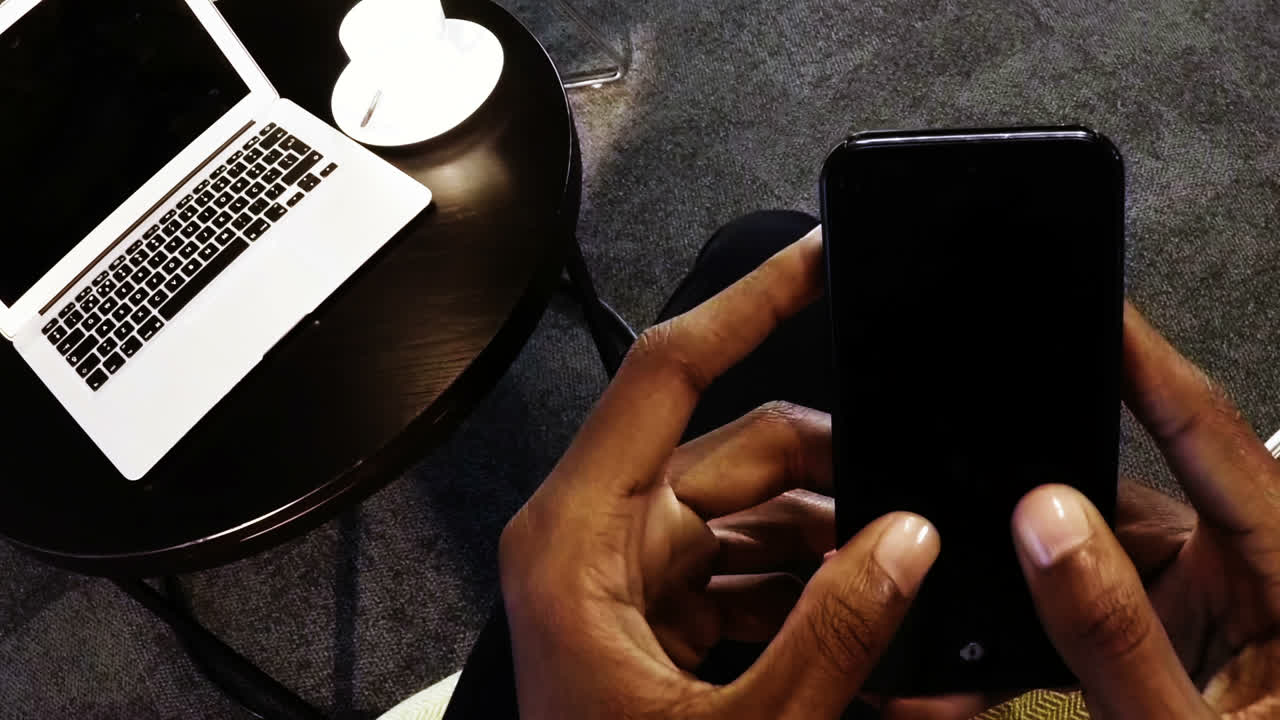 Hands of a businesswoman using mobile phone