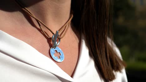 Cross-Pendant-on-Leather-Necklace-Close-up